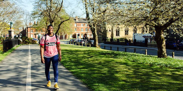 Biological Sciences student walking on campus