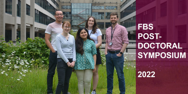 Group of 5 postdocs (3 female, 2 male) in front of the Faculty of Biological sciences and the overlay text &quot;FBS POST-DOCTORAL SYMPOSIUM 2022&quot;