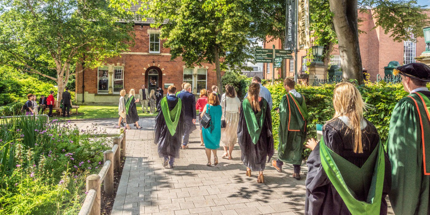 Students in graduation robes walking from the Great Hall to LUU