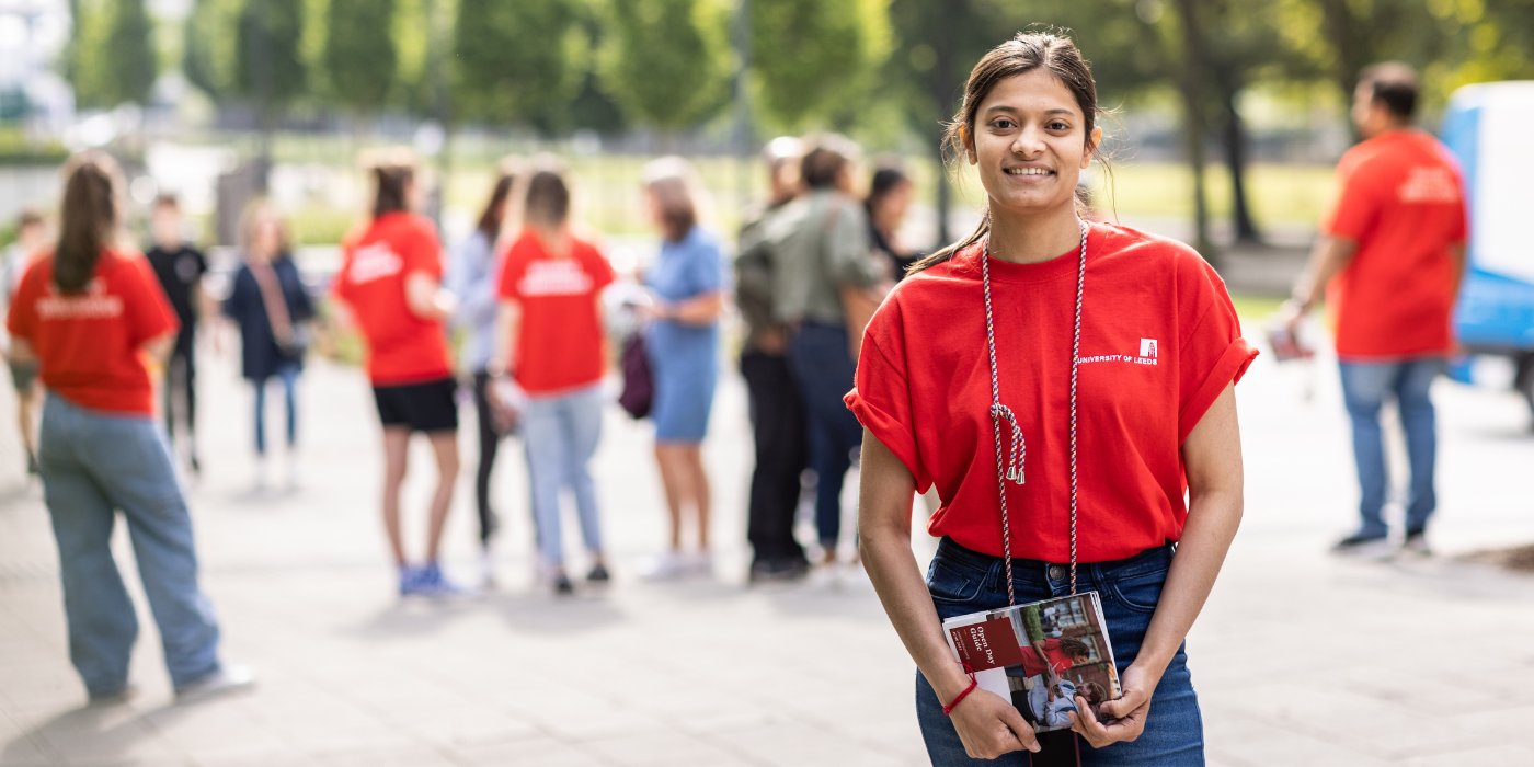 Open Day event banner student in red ambassador shirt