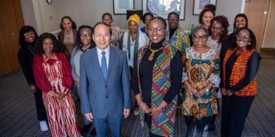 Participants of Leeds 100 black women professors now, Dr Kendi Guantai, Dean for Equity, Diversity and Inclusion (EDI), and Provost and Deputy Vice-Chancellor Professor Hai-Sui Yu smile at the camera.