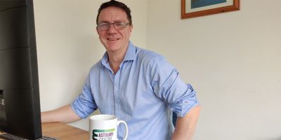 Professor Neil Ranson sitting at his desk