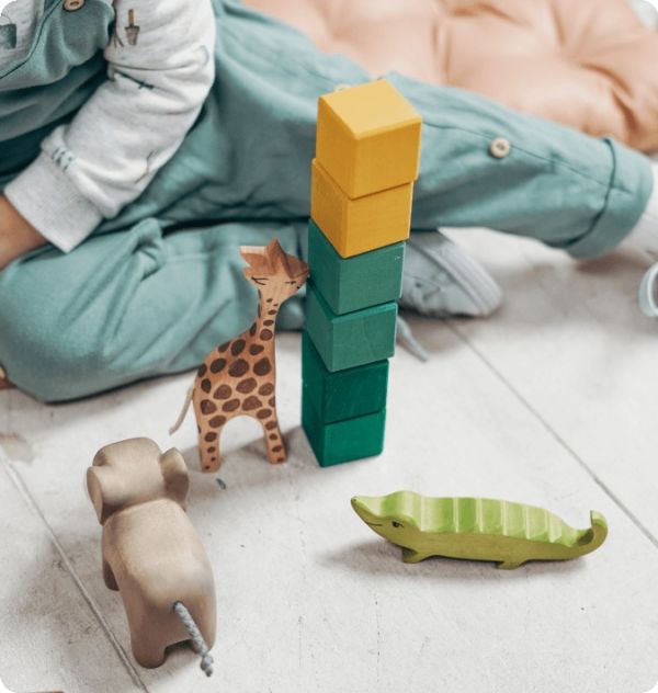 Children's toys with child in the background