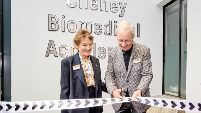Susan and Peter Cheney cut ribbon