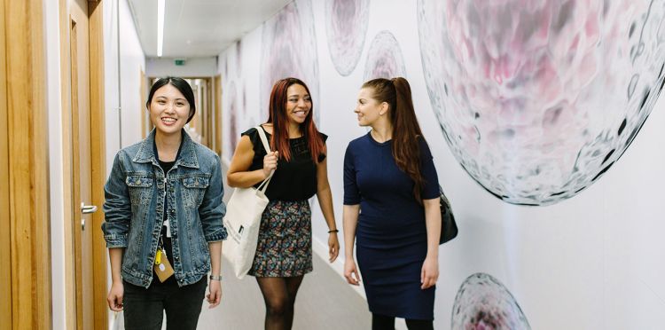 Masters students walking down the corridors of the Worsley building at the University of Leeds