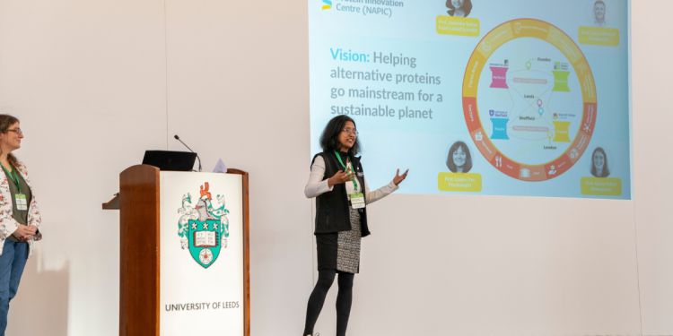 Professor anwesha sarkar presents at the napic launch on stage