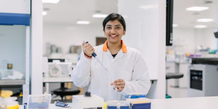 Student pictured working in lab